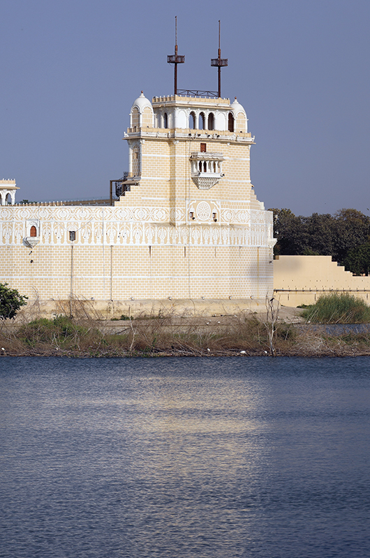 Beautiful Palace in middle of the lakhota lake Jamnagar India with white stone shine and water, Palace stock image