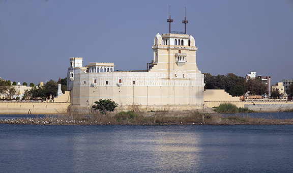 Beautiful Palace in middle of the lakhota lake Jamnagar India with white stone shine and water, Palace stock image